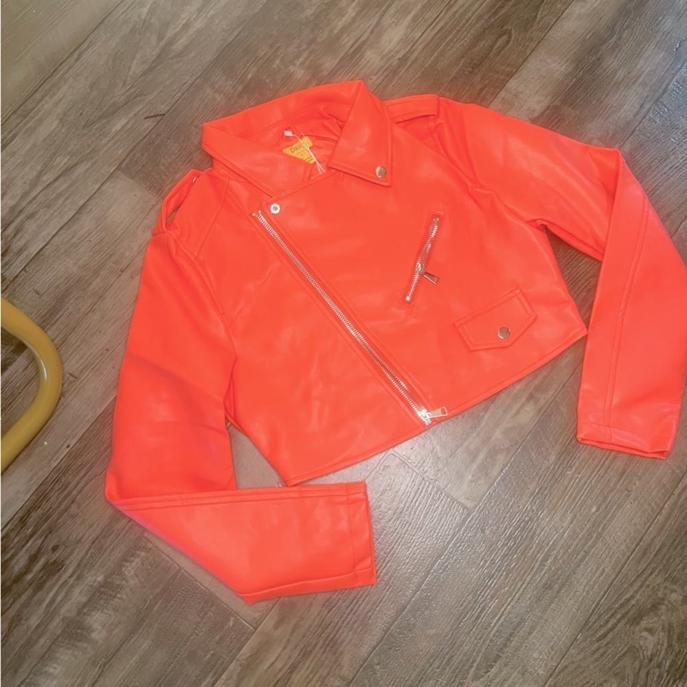 Brand New Pleather Jacket. It’s a pinkish orange.